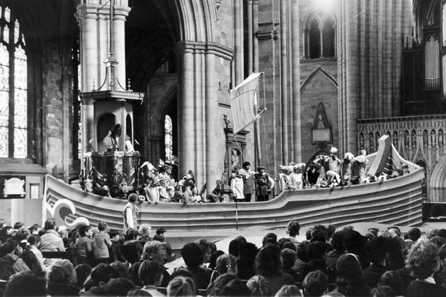 The scene in Ripon Cathedral during the dress rehearsal of Benjamin Britten's opera, "Noye's Fludde", which opened in May 1972 as part of the cathedral's 1,300th anniversary festival. Schoolchildren in animal costumes are crowded into the Ark, which is built round the ornate pulpit. Noye (Noah) played by Patrick McGuigan, uses the pulpit as the Ark's bridge. Over the last three months, nearly 300 children from seven schools had been busy, either rehearsing for the opera or making costumes for it. The Ark was built by John Chambers and sixth form pupils at Ripon Grammar School and designed by Timothy Proud.

Animal costumes have been designed by Mr. Anthony Smith, of Ripon Grammar School.

The orchestra is headed by the West Riding String Quartet.

Mrs. Noye is played by Caroline Crawshaw. The conductor is Mr. Paul Shepherd of Leeds, and the producer in Miss Olive Hunter.