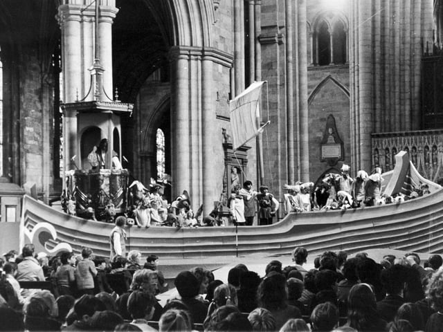 The scene in Ripon Cathedral during the dress rehearsal of Benjamin Britten's opera, "Noye's Fludde", which opened in May 1972 as part of the cathedral's 1,300th anniversary festival. Schoolchildren in animal costumes are crowded into the Ark, which is built round the ornate pulpit. 