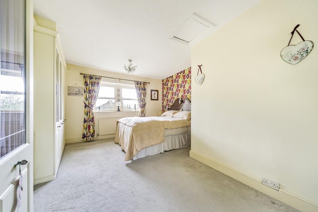 The main bedroom is very large as it was formerly two separate rooms. There is natural light and built in wardrobes. Picture: Linley and Simpson.