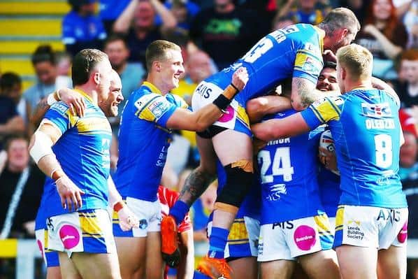 Rhinos celebrate Rhyse Martin's try which clinched the win over Salford. Picture by Matt West/SWpix.com.