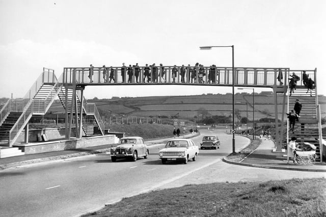 Priesthorpe School pupils use the new bridge which has been built for them by Pudsey Council so that they can safely cross the Ring Road in May 1967.
