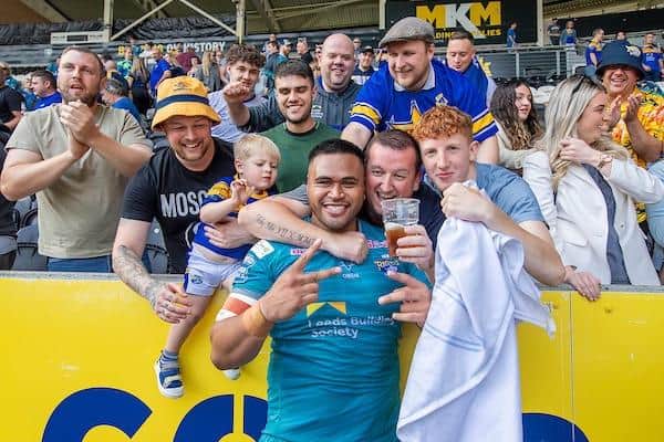 Hat-trick hero Sam Lisone celebrates with fans after Rhinos' 28-12 win at Hull FC. Picture by Allan McKenzie/SWpix.com.