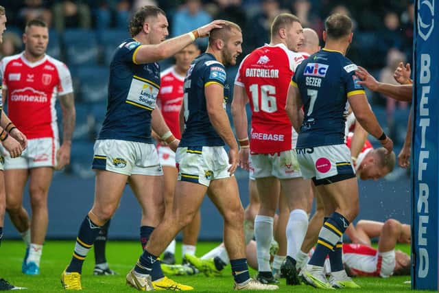Jarrod O'Connor is congratulated by Cameron Smith after scoring for Rhinos against Hull KR. Picture by Bruce Rollinson