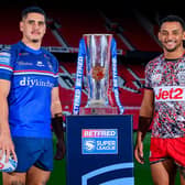 Wakefield Trinity's Caleb Hamlin-Uele and Leigh Leopards' Umyla Hanley with the Betfred Super League trophy at Old Trafford this week. Picture by Allan McKenzie/SWpix.com.