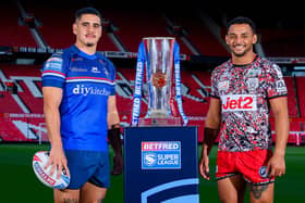 Wakefield Trinity's Caleb Hamlin-Uele and Leigh Leopards' Umyla Hanley with the Betfred Super League trophy at Old Trafford this week. Picture by Allan McKenzie/SWpix.com.