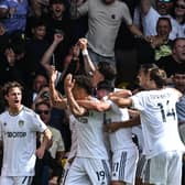 DREAMLAND: Leeds United celebrate going 2-0 up against Chelsea through Rodrigo, centre, after the opening goal from Brenden Aaronson, left.
Photo by PAUL ELLIS/AFP via Getty Images.