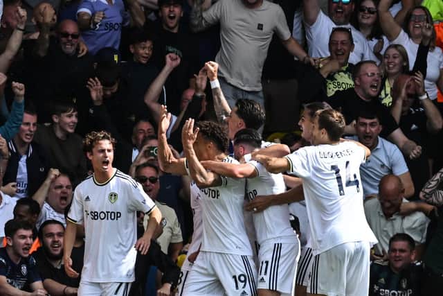 DREAMLAND: Leeds United celebrate going 2-0 up against Chelsea through Rodrigo, centre, after the opening goal from Brenden Aaronson, left.
Photo by PAUL ELLIS/AFP via Getty Images.