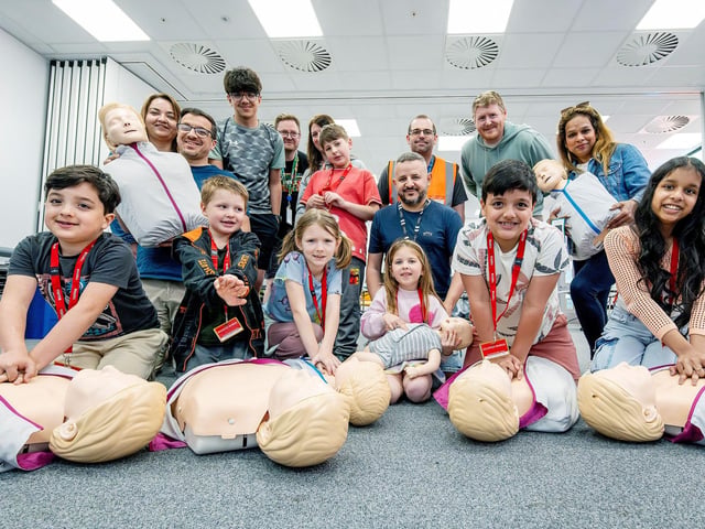 Amazons Mark Fisher and James Hassall teach the mini medics first aid.