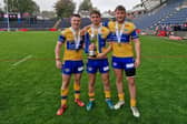 Noah Whittingham, right, alongside Elliott Fox and Harry Smith following Leeds Rhinos reserves' Grand Final win against Warrington Wolves last year. Picture by Peter Smith.
