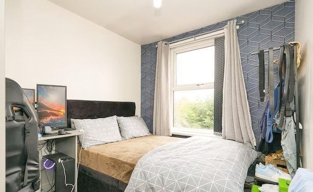 The property is arranged over four floors with the second bedroom featuring potential office space.