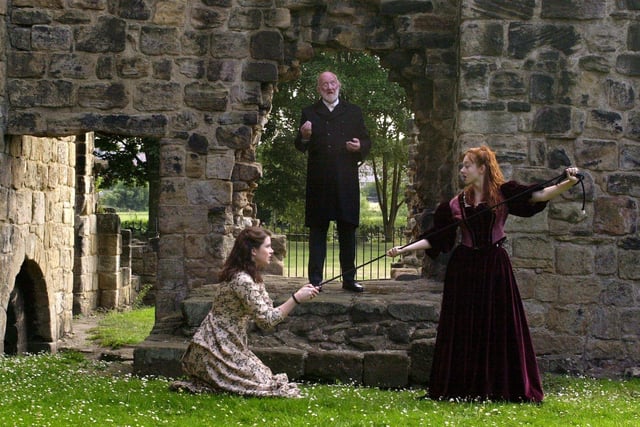 Kirkstall Abbey staged the Shakespeare Festival's 'Taming of the Shrew' and Macbeth Tour in July 2001. Pictured is Nicholas Smith as Baptista Minola, a wealthy citizen of Padua with Elisha Gazdowicz, left, as Bianca, younger daughter of Baptista and Melisande Cook, right, as Katherine, the shrew.