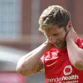 YORK, ENGLAND - AUGUST 03:  Richard Cresswell of York City leaves the pitch after a clash of heads during the Sky Bet League Two match between York City and Northampton Town at Bootham Crescent on August 3, 2013 in York, England.  (Photo by Pete Norton/Getty Images)
