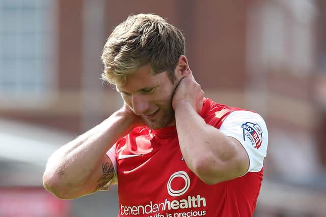 YORK, ENGLAND - AUGUST 03:  Richard Cresswell of York City leaves the pitch after a clash of heads during the Sky Bet League Two match between York City and Northampton Town at Bootham Crescent on August 3, 2013 in York, England.  (Photo by Pete Norton/Getty Images)