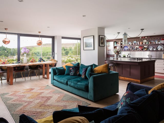 Living and dining areas link with the kitchen, and have full size sliding doors giving access to outdoors.