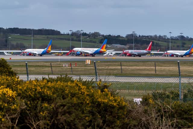 In August, the airport installed electronic screens providing passengers with live updates on estimated wait times. Picture: James Hardisty