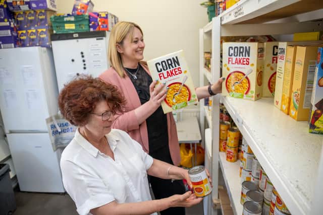 B&DWYW - SGB-26347 - Lindsey helping the team at Cleckheaton Food Bank stock the shelves