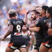 Ex-Leeds Rhinos player Aidan Sezer celebrates with teammates after kicking the winning drop goal for Wests Tigers against Parramatta Eels at CommBank Stadium in Sydney today. Picture by Matt King/Getty Images.