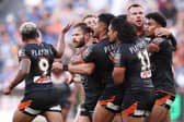 Ex-Leeds Rhinos player Aidan Sezer celebrates with teammates after kicking the winning drop goal for Wests Tigers against Parramatta Eels at CommBank Stadium in Sydney today. Picture by Matt King/Getty Images.
