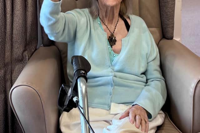 Resident at Windsor Court Care Home enjoying Travel the World with Musical Moments session
