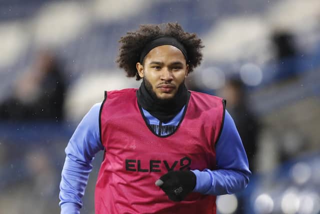 HUDDERSFIELD, ENGLAND - DECEMBER 08: Izzy Brown of Sheffield Wednesday warms up on the sideline during the Sky Bet Championship match between Huddersfield Town and Sheffield Wednesday at John Smith's Stadium on December 08, 2020 in Huddersfield, England. (Photo by George Wood/Getty Images)