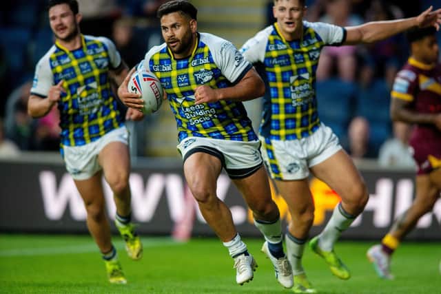 Rhinos' Rhyse Martin, seen scoring against Huddersfield last week, needs 18 points to reach 1,000 for his career. Picture by Bruce Rollinson.