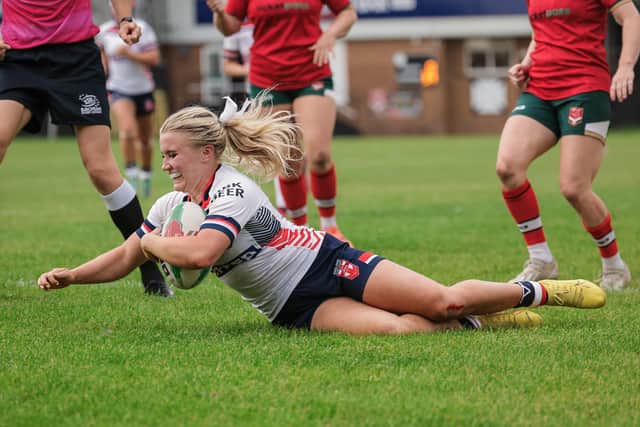 Leeds Rhinos' Bella Sykes scores for England in last week's win against Wales in Neath. Picture by Alex Whitehead/SWpix.com.
