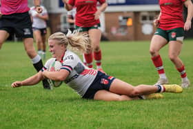 Leeds Rhinos' Bella Sykes scores for England in last week's win against Wales in Neath. Picture by Alex Whitehead/SWpix.com.