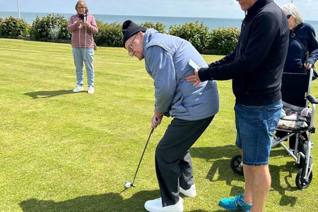 Margaret Gee's finalist photo of husband, Brian, supporting her 98-year-old dad.