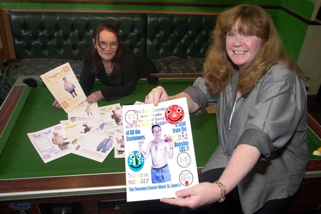 Drinkers at the Golden Lion in Beeston showcase an all-male charity calender they designed in November 2001.