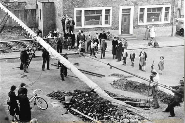 Hauling the present one into place, 40 years ago. Image: Hitch family