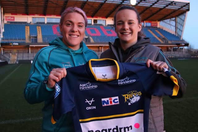Star signing Amy Hardcastle, left, with Rhinos coach Lois Forsell.
