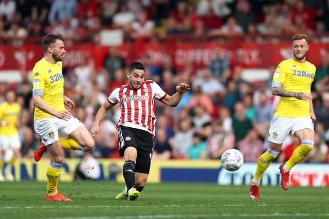 PREVIOUS: Whites duo Stuart Dallas, left, and Liam Cooper, right, look on as Neal Maupay nets for Brentford in the Championship clash against Leeds United of April 2019 at Griffin Park. Photo by Bryn Lennon/Getty Images.