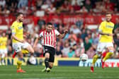PREVIOUS: Whites duo Stuart Dallas, left, and Liam Cooper, right, look on as Neal Maupay nets for Brentford in the Championship clash against Leeds United of April 2019 at Griffin Park. Photo by Bryn Lennon/Getty Images.