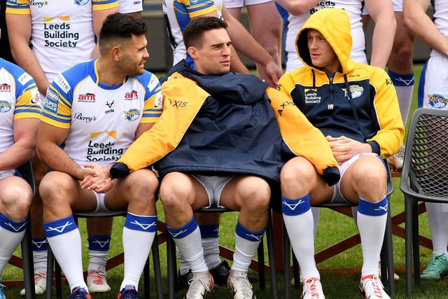 Former Man of Steel Brodie Croft tries to keep warm at Leeds Rhinos' pre-season photocall, flanked by Rhyse Martin,  left and Harry Newman.