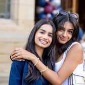 Ayesha celebrates with her friend Priya Gill, of Pudsey, near Leeds,