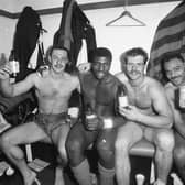 Paul Dixon, third from left, celebrates with fellow Leeds players (left-right)  Garry Schofield, Roy Powell and Carl Gibson in the Wembley changing room after Great Britain's win over Australia in 1990. Picture by Steve Riding.