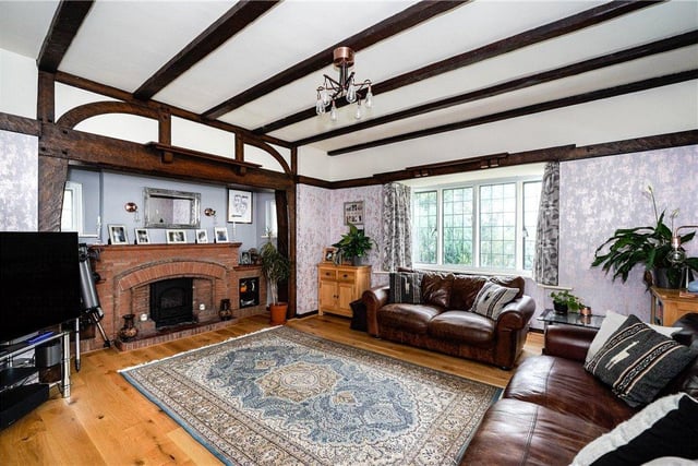 This sizeable room has a feature brick fireplace as its focal point.