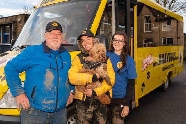 Ray Weldrand, Laura Mohan, Lily Forsyth, and Billy the Dog with Billy's Bus, a dog walking service that has gone viral for its quirky method of transporting the dogs to their field Charley Atkins / SWNS