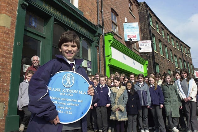 Michael Dowe and fellow pupils of Holy Name Primary School, Cookridge, before going on a tour of The Blue Plaques in Leeds City Centre. Michael was holding the latest Blue Plaque,  which celebrates the life of Frank Kidson, musical and antiquarian and folk song collection for Hamilton Avenue, Chapeltown.