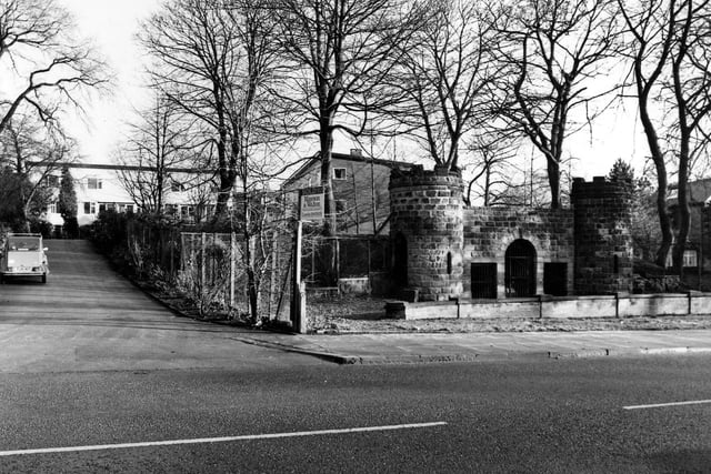 The Victorian Bear Pit on Cardigan Road in January 1985 which was built as part of the Leeds Zoological and Botanical Gardens opening in 1840. The castellated turrets were safe viewing platforms for visitors to observe the bear kept in the circular bear pit behind the wall. They were accessed by spiral staircases within the towers. The gardens were re-named Leeds Royal Gardens in 1848. To the left the road is Regency Court leading to flats.