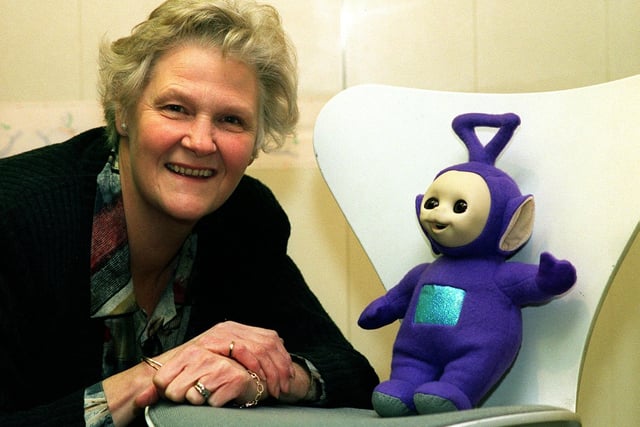 November 1997 and Kathleen Horton of Horton and Hollander on Wetherby  High Street is pictured with Tinky-Winky,  a teletubby she was going to auction  with the funds going towards her local church at Spofforth.