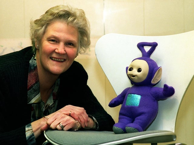November 1997 and Kathleen Horton of Horton and Hollander on Wetherby High Street is pictured with Tinky-Winky, a teletubby she was going to auction with the funds going towards her local church at Spofforth.