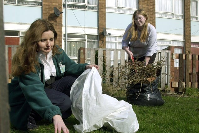 Neighbourhood warden Lynn Barnes with resident Debbie Furniss help with a big community clean up in February 2003.