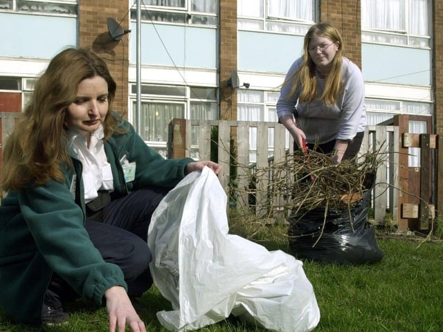 Neighbourhood warden Lynn Barnes with resident Debbie Furniss help with a big community clean up in February 2003.
