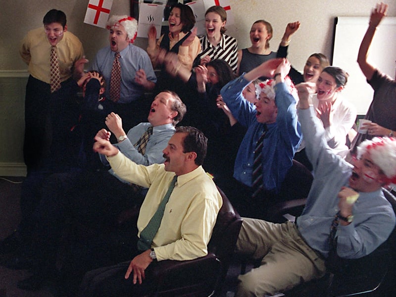 Staff at Sinclair Mason PR on Town Street take a break from work as they watch England play Tunisia in the World Cup in June 1998.