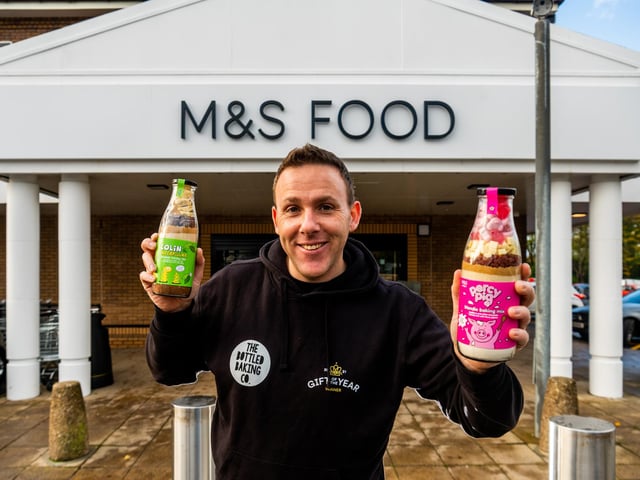 Greg is pictured with his Percy Pig™ and Colin the Caterpillar™ baking mixes