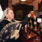 Bridget McGourty, left, who had worked in the Victoria pub on Great George Street, Leeds, for 25 years, hands over a pint of Tetley's to Queen Victoria look-alike Moira Main. The pub celebrated its re-opening following a £300,000 refurbishment and, to mark Bridget's long service with the brewery, one of its bars was named after her.