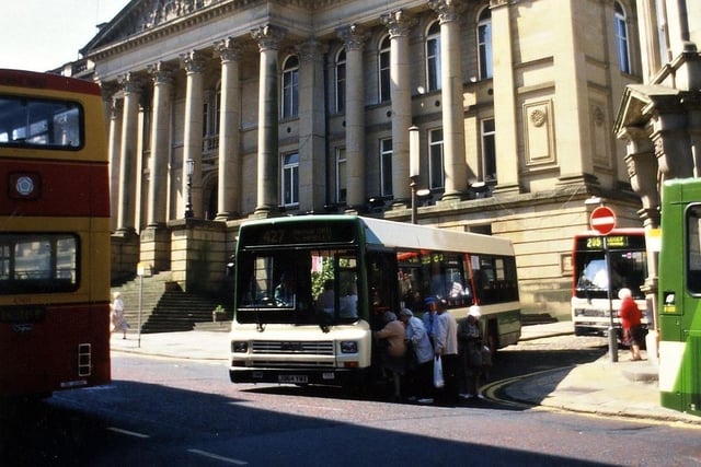 The start of pedestrianisation of Queen Street between The Town Hall and the Fountain in July 1995 brought chaos to the buses in the centre of Morley. Here, at the junction of Wellington Street and Queen Street, four buses can be seen.