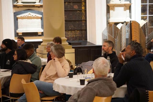 Local activists and community organisers listen intently to panel wisdom