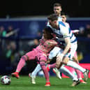 ANGER: Shown by Leeds United star Crysencio Summerville, left, pictured battling with QPR's Jimmy Dunne in Friday night's crushing 4-0 defeat at Championship hosts Queens Park Rangers. Photo by Steven Paston/PA Wire.